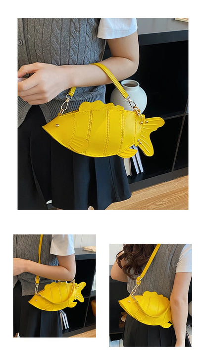 A bright yellow fish-shaped shoulder bag with a strap, shown worn by a person in three views: a large front view and two smaller side/back views. The bag has a gold-tone chain detail and is photographed in an indoor setting.