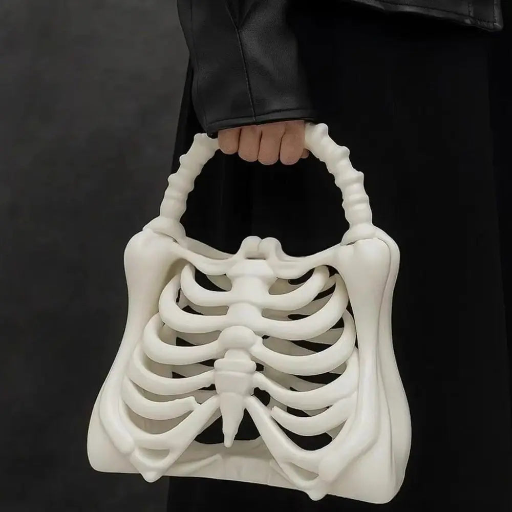 White skeleton handbag held by a person against a dark background