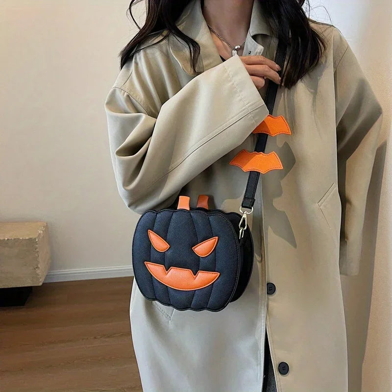 Person wearing a beige coat holding a black Halloween-themed bag with orange accents.